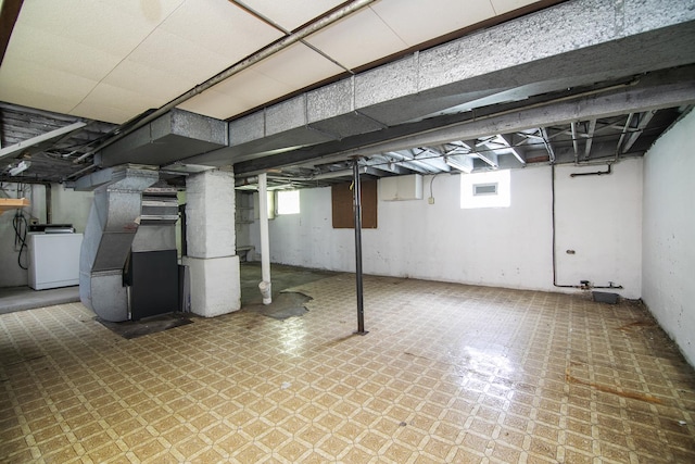 866 S Evergreen Ave, Kankakee, IL 60901 - basement featuring washer / clothes dryer, tile patterned floors, plenty of natural light, and heating unit