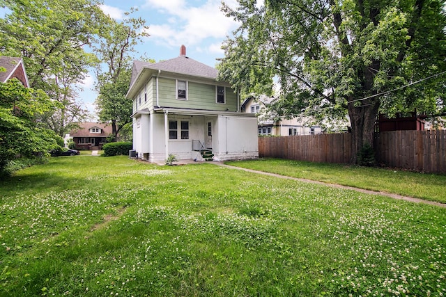 866 S Evergreen Ave, Kankakee, IL 60901 - back of house featuring a chimney, entry steps, and roof with shingles