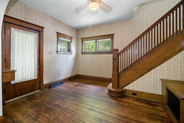 866 S Evergreen Ave, Kankakee, IL 60901 - foyer with wallpapered walls, wood-type flooring, a ceiling fan, and stairs