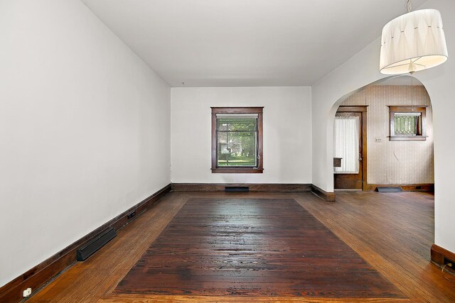 866 S Evergreen Ave, Kankakee, IL 60901 - spare room featuring arched walkways and hardwood / wood-style flooring