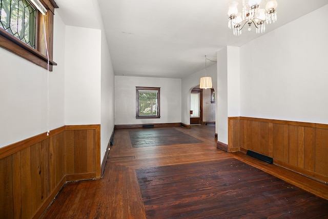 866 S Evergreen Ave, Kankakee, IL 60901 - entryway with wooden walls, arched walkways, wainscoting, hardwood / wood-style flooring, and a chandelier