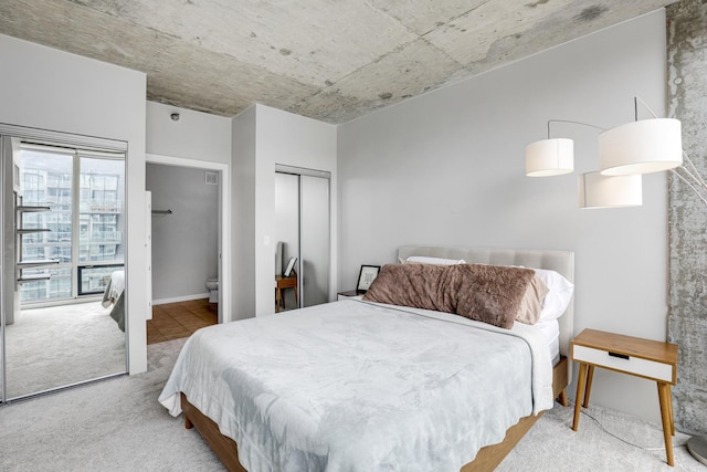 611 S Wells St Unit 1304, Chicago, IL 60607 - carpeted bedroom featuring connected bathroom and a closet