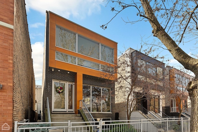 1807 W Ohio St, Chicago, IL 60622 - view of front of property featuring a fenced front yard, brick siding, and entry steps
