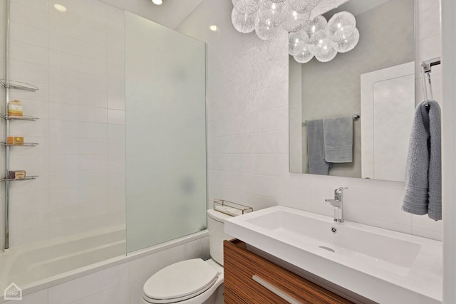 1807 W Ohio St, Chicago, IL 60622 - bathroom featuring tiled shower / bath combo, vanity, tile walls, and a chandelier