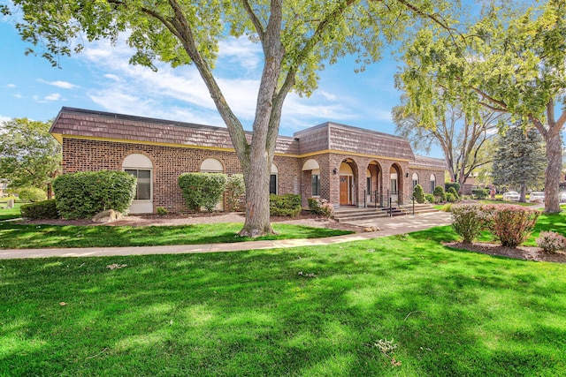 10 Cour Masson Unit 10, Palos Hills, IL 60465 - view of property with mansard roof, brick siding, and a front lawn