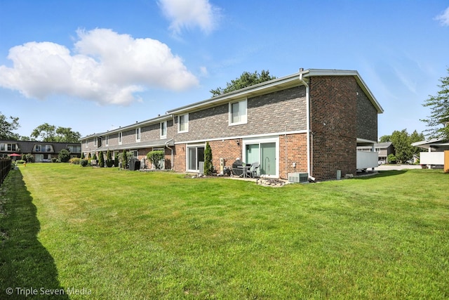 10 Cour Masson Unit 10, Palos Hills, IL 60465 - back of property with brick siding and a yard