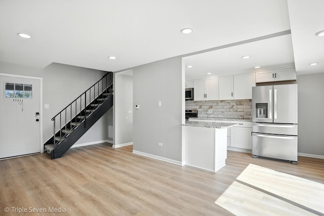 10 Cour Masson Unit 10, Palos Hills, IL 60465 - kitchen with appliances with stainless steel finishes, white cabinetry, decorative backsplash, light wood-type flooring, and recessed lighting