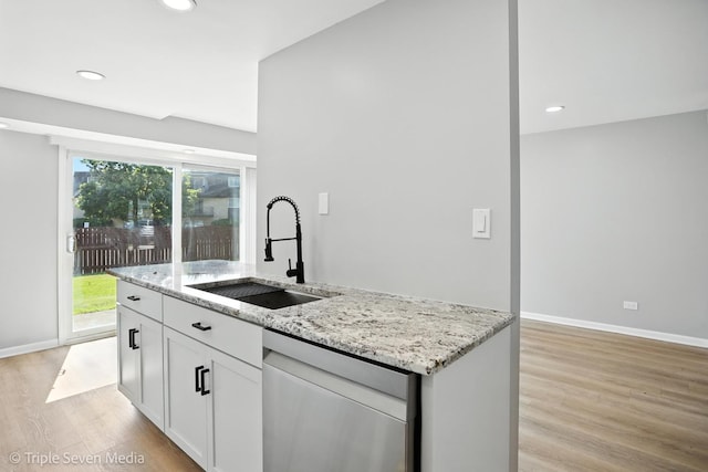 10 Cour Masson Unit 10, Palos Hills, IL 60465 - kitchen with stainless steel dishwasher, light wood finished floors, light stone counters, white cabinets, and recessed lighting