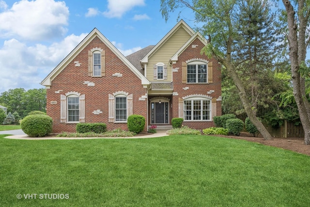 605 Red Cypress Dr, Cary, IL 60013 - view of front of home with brick siding and a front yard