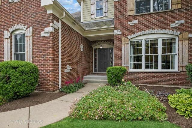605 Red Cypress Dr, Cary, IL 60013 - property entrance with brick siding and a shingled roof