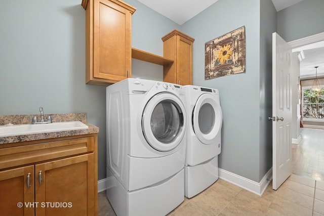 605 Red Cypress Dr, Cary, IL 60013 - washroom featuring cabinet space, washing machine and clothes dryer, and light tile patterned floors