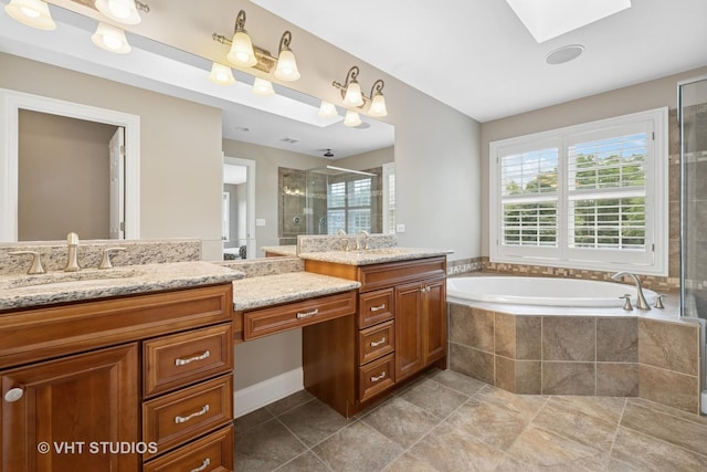 605 Red Cypress Dr, Cary, IL 60013 - bathroom with a skylight, two vanities, a stall shower, a bath, and tile patterned flooring