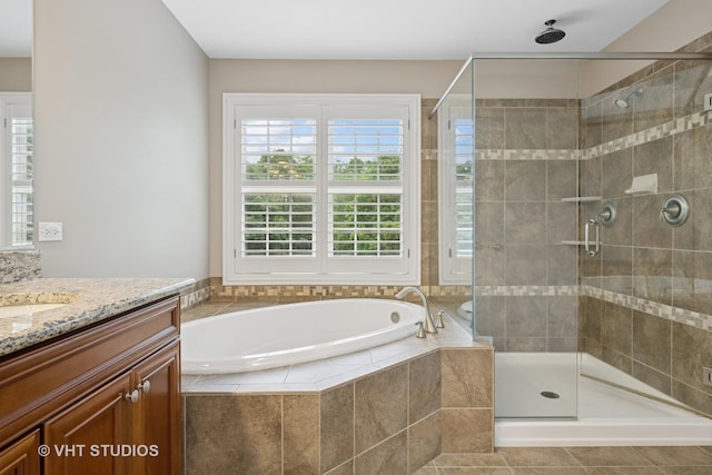 605 Red Cypress Dr, Cary, IL 60013 - bathroom with vanity, a garden tub, and a shower stall