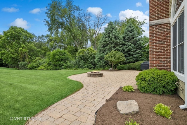 605 Red Cypress Dr, Cary, IL 60013 - view of grassy yard with a fire pit and a patio area