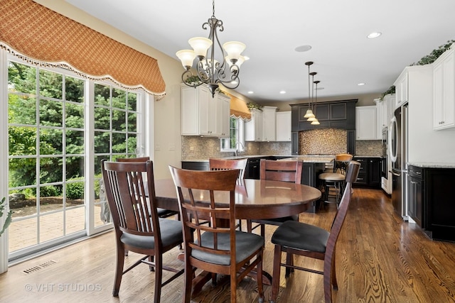 605 Red Cypress Dr, Cary, IL 60013 - dining space featuring a chandelier, wood finished floors, and recessed lighting