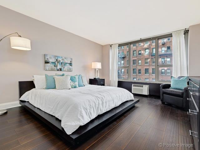 1550 N Lake Shore Dr Unit 3G, Chicago, IL 60610 - bedroom featuring dark wood-type flooring and an AC wall unit