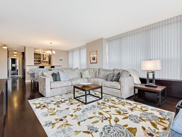1550 N Lake Shore Dr Unit 3G, Chicago, IL 60610 - living room featuring a chandelier and dark wood finished floors