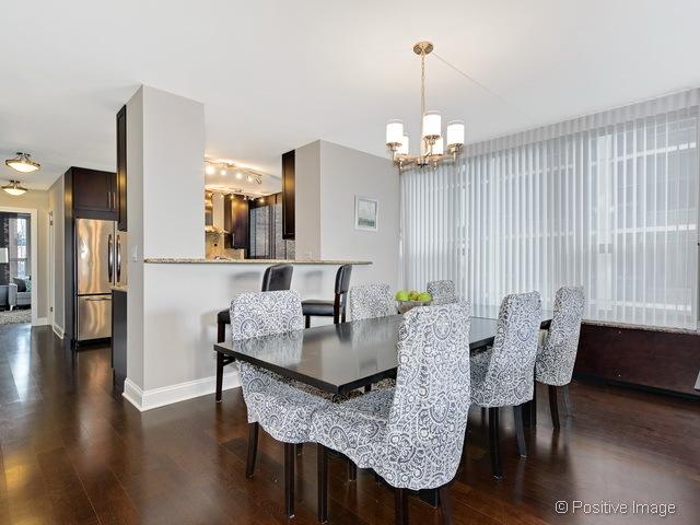 1550 N Lake Shore Dr Unit 3G, Chicago, IL 60610 - dining space featuring a chandelier and dark wood finished floors