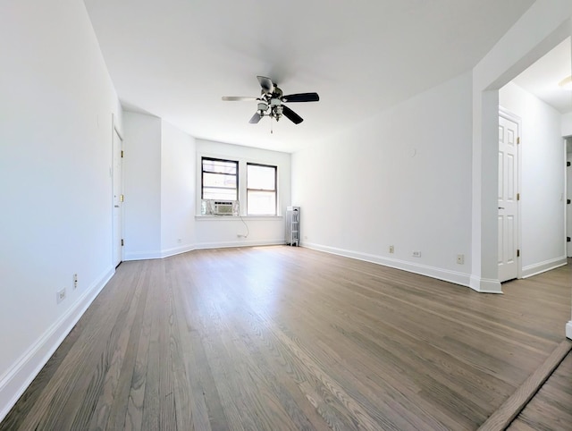 5655 N Spaulding Ave Unit 2W, Chicago, IL 60659 - spare room with ceiling fan, wood finished floors, and cooling unit