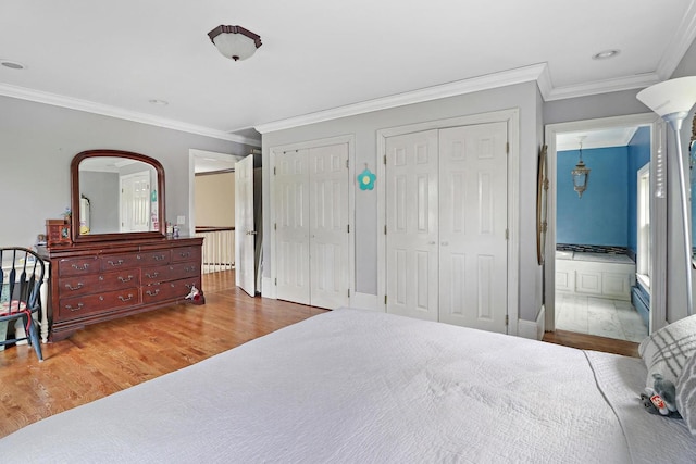 29460 Roberts Rd, Mchenry, IL 60051 - bedroom featuring multiple closets, wood finished floors, crown molding, and ensuite bath