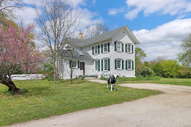 29460 Roberts Rd, Mchenry, IL 60051 - colonial house with a chimney, a front yard, and roof with shingles
