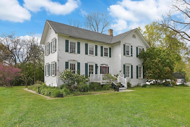 29460 Roberts Rd, Mchenry, IL 60051 - colonial house with a chimney, a front yard, and roof with shingles