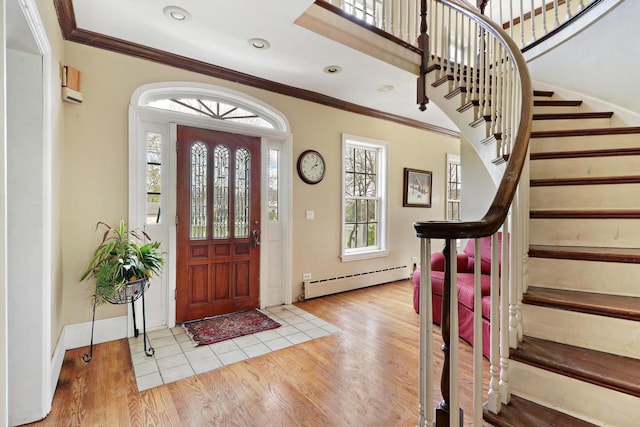 29460 Roberts Rd, Mchenry, IL 60051 - entrance foyer with baseboard heating, wood finished floors, stairs, ornamental molding, and recessed lighting