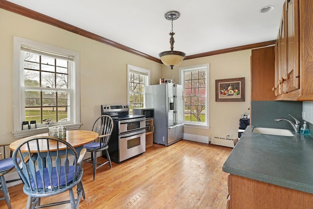 29460 Roberts Rd, Mchenry, IL 60051 - kitchen featuring appliances with stainless steel finishes, ornamental molding, brown cabinets, light wood-type flooring, and baseboard heating