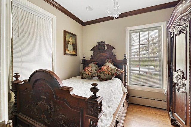 29460 Roberts Rd, Mchenry, IL 60051 - bedroom with baseboard heating, light wood-type flooring, and ornamental molding
