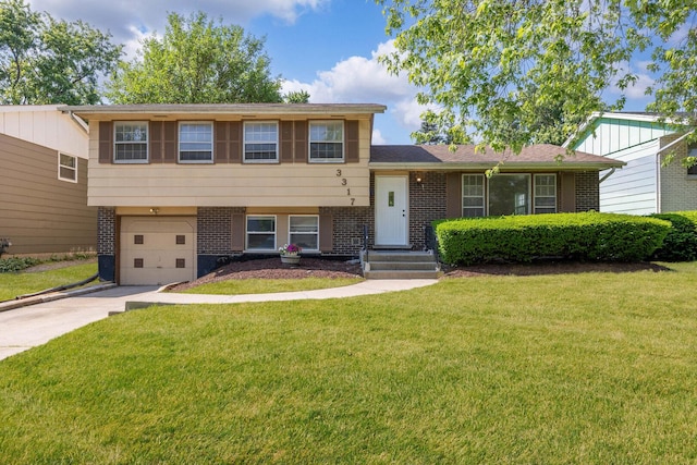 3317 Birchwood Dr, Hazel Crest, IL 60429 - split level home featuring brick siding, concrete driveway, an attached garage, and a front yard