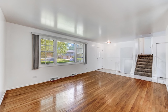3317 Birchwood Dr, Hazel Crest, IL 60429 - unfurnished living room featuring hardwood / wood-style flooring and stairway