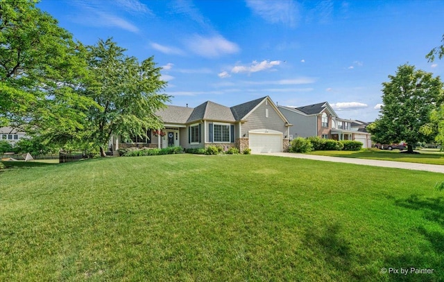 2519 Imgrund Rd, North Aurora, IL 60542 - view of front facade with concrete driveway, an attached garage, a front yard, and stone siding