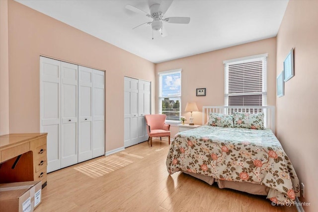 2519 Imgrund Rd, North Aurora, IL 60542 - bedroom with light wood-style flooring, multiple closets, and a ceiling fan
