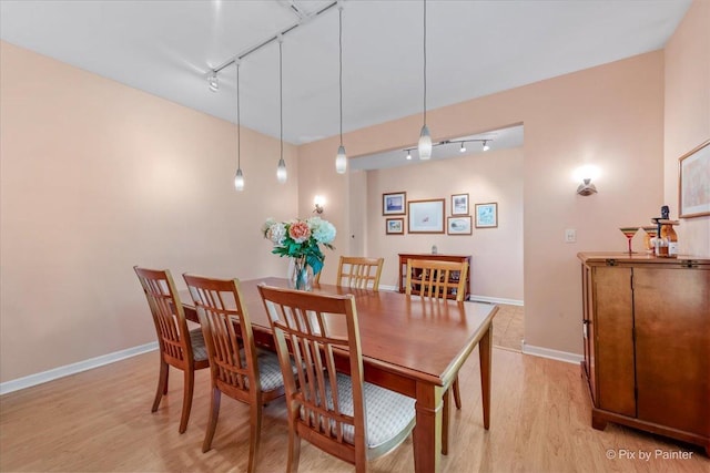 2519 Imgrund Rd, North Aurora, IL 60542 - dining area with rail lighting and light wood-type flooring