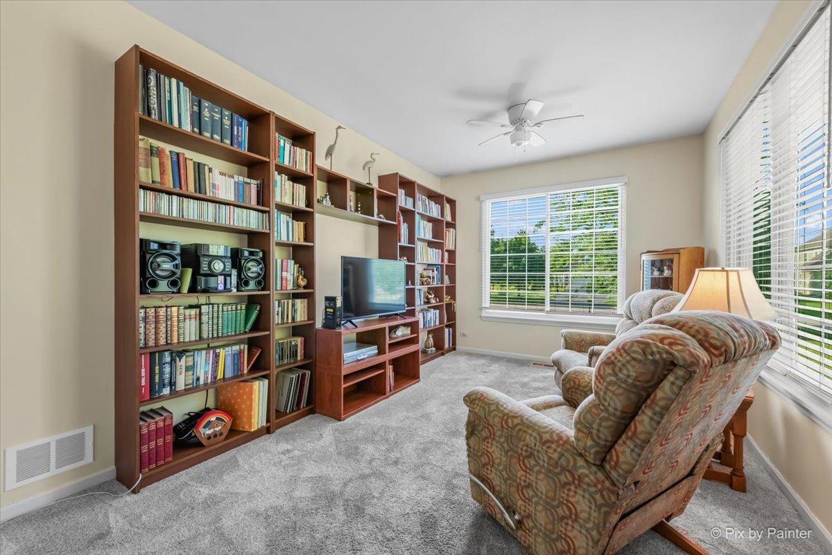 2519 Imgrund Rd, North Aurora, IL 60542 - living area featuring carpet and ceiling fan