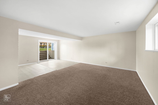 728 Boxwood Dr, Schaumburg, IL 60193 - empty room with light carpet and plenty of natural light