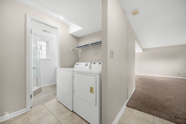728 Boxwood Dr, Schaumburg, IL 60193 - laundry area featuring independent washer and dryer, light tile patterned floors, and light carpet