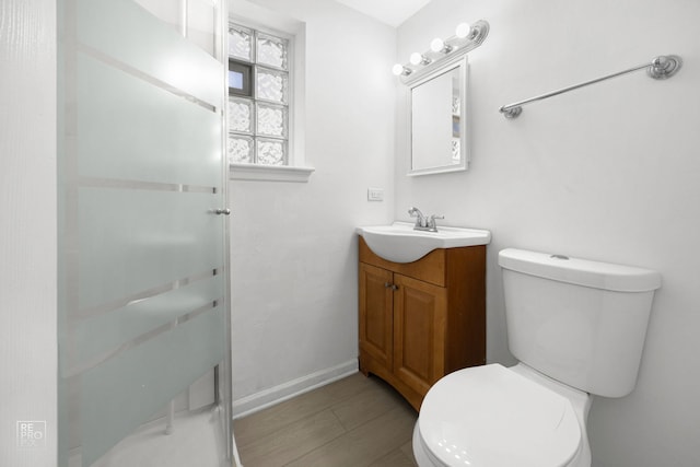 728 Boxwood Dr, Schaumburg, IL 60193 - full bathroom featuring vanity, a shower stall, and wood finished floors