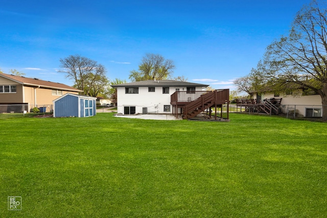 728 Boxwood Dr, Schaumburg, IL 60193 - rear view of property with stairs, a storage shed, a wooden deck, and a patio area