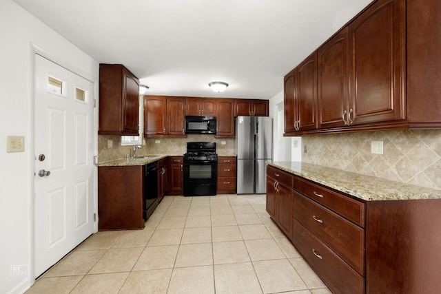 728 Boxwood Dr, Schaumburg, IL 60193 - kitchen featuring black appliances, light tile patterned floors, light stone countertops, and backsplash