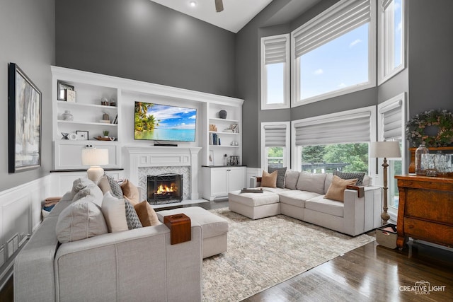 40W379 E Laura Ingalls Wilder Rd, Saint Charles, IL 60175 - living area with high vaulted ceiling, a fireplace with flush hearth, wood finished floors, and a ceiling fan