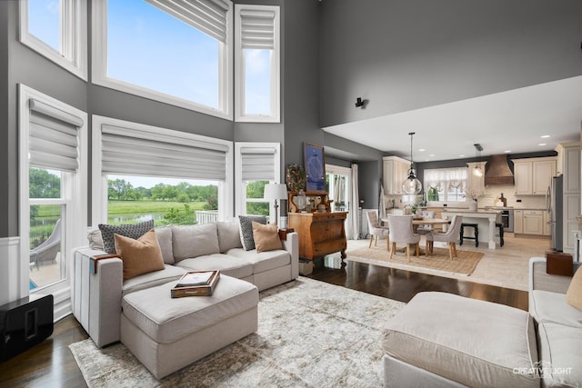 40W379 E Laura Ingalls Wilder Rd, Saint Charles, IL 60175 - living room with a high ceiling, light wood-type flooring, and recessed lighting