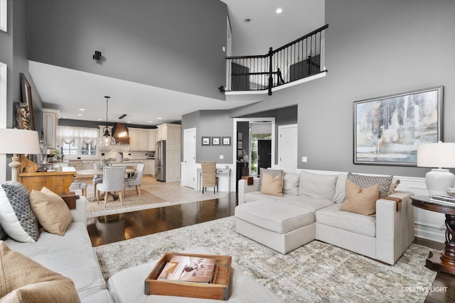 40W379 E Laura Ingalls Wilder Rd, Saint Charles, IL 60175 - living room with light wood-style flooring, a towering ceiling, and recessed lighting