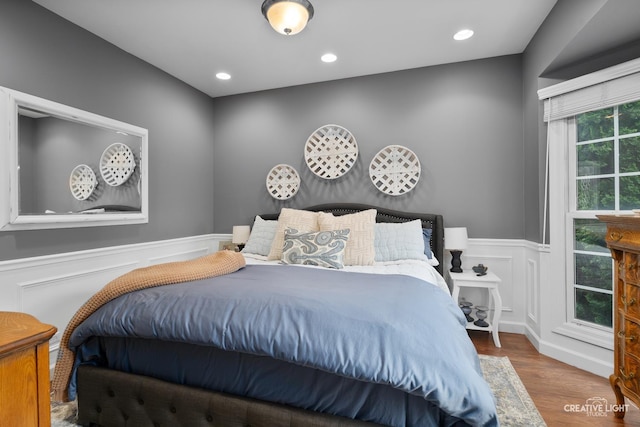 40W379 E Laura Ingalls Wilder Rd, Saint Charles, IL 60175 - bedroom featuring a wainscoted wall, wood finished floors, a decorative wall, and recessed lighting