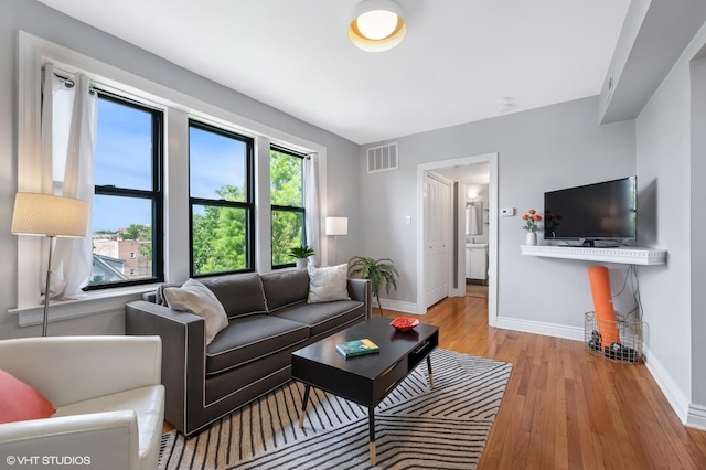 2709 W Belden Ave Unit 3, Chicago, IL 60647 - living room with baseboards and light wood-style flooring