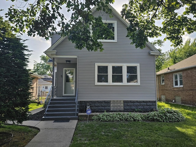 12136 S Wentworth Ave, Chicago, IL 60628 - view of front of house featuring a front lawn