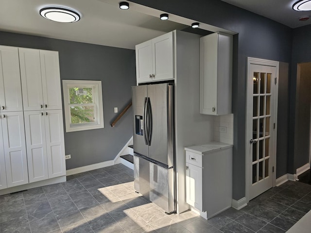 12136 S Wentworth Ave, Chicago, IL 60628 - kitchen with stainless steel fridge with ice dispenser and white cabinets