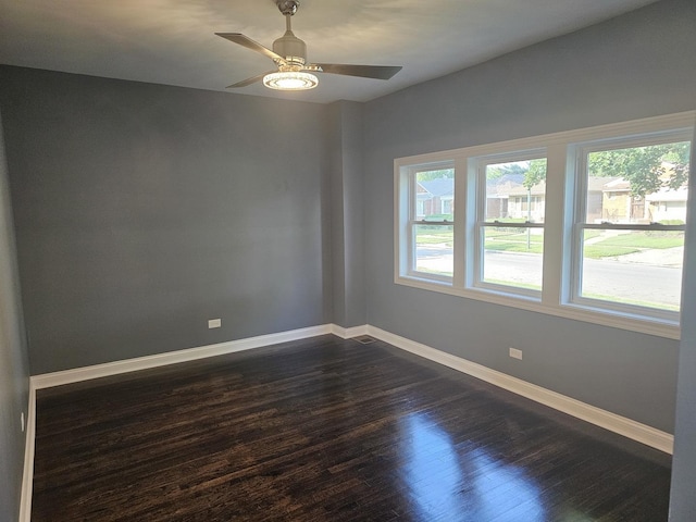 12136 S Wentworth Ave, Chicago, IL 60628 - unfurnished room with dark wood-style flooring and ceiling fan