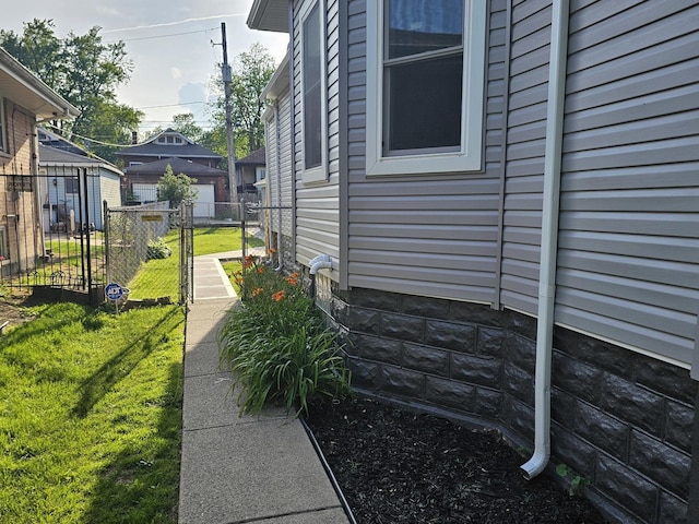 12136 S Wentworth Ave, Chicago, IL 60628 - view of property exterior with a gate