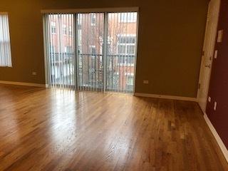 343 E 25th Pl Unit 18C, Chicago, IL 60616 - spare room with baseboards and wood finished floors